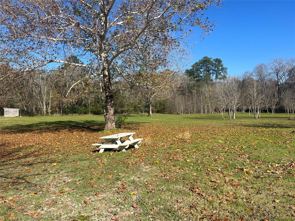 a view of a lake with a yard