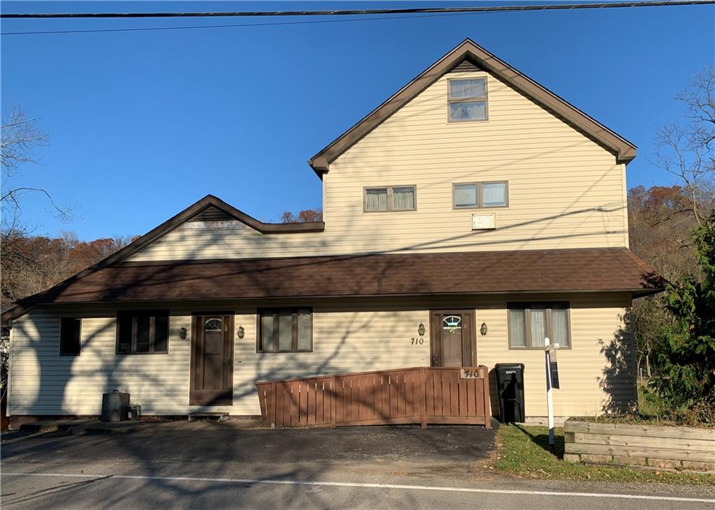 a view of a house with a street