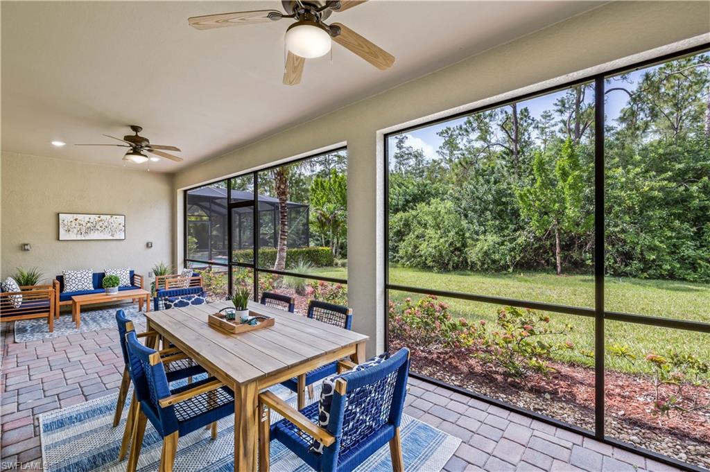 a view of a dining room with furniture window and outside view