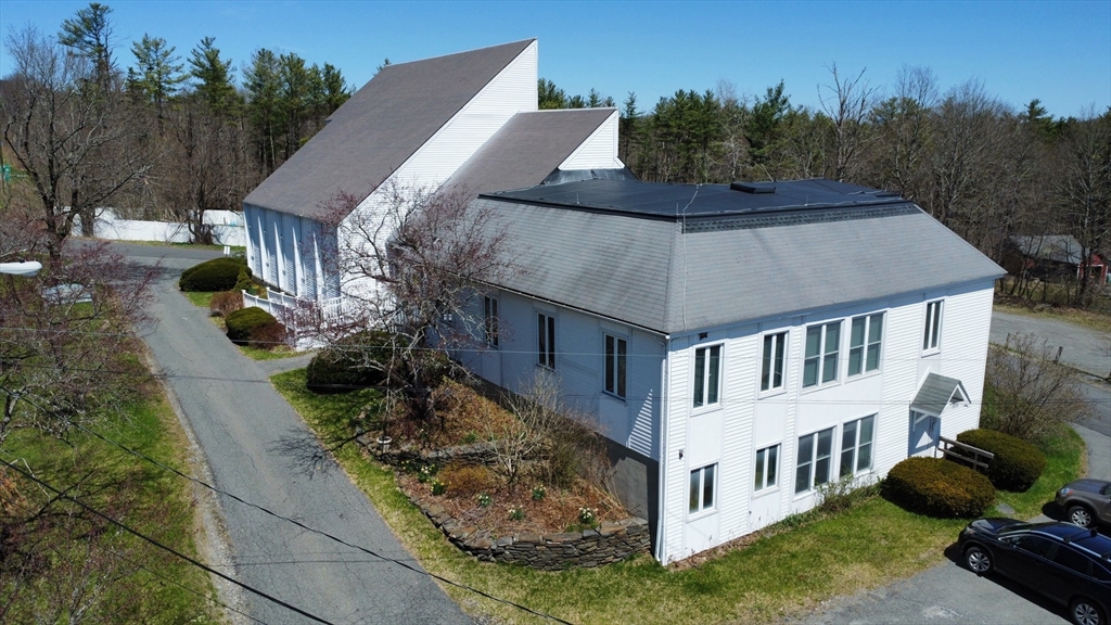 a aerial view of a house with a yard