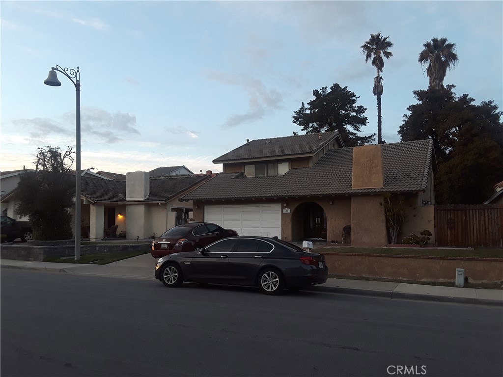 a car parked in front of a house