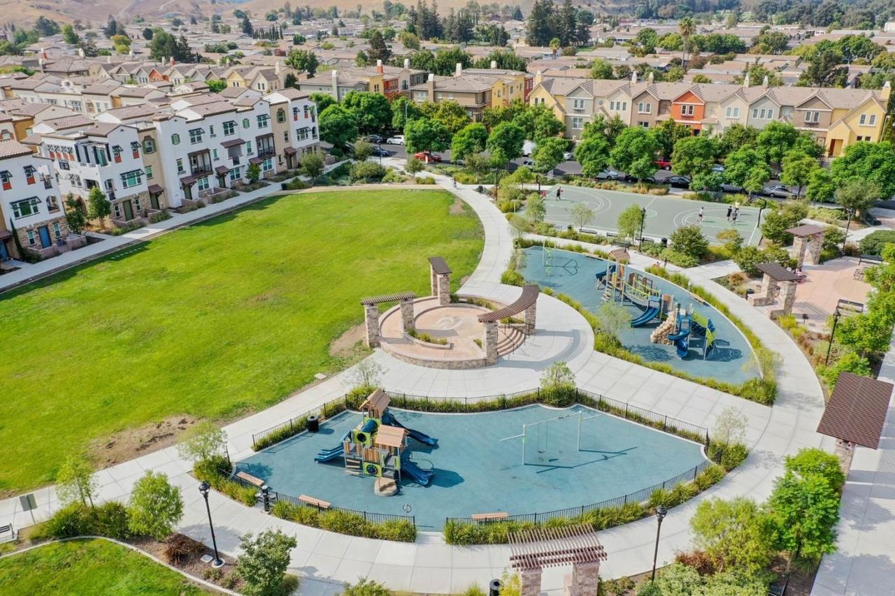 a view of a swimming pool with a yard and seating