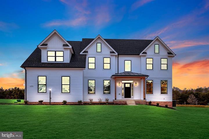 front view of brick house with a yard