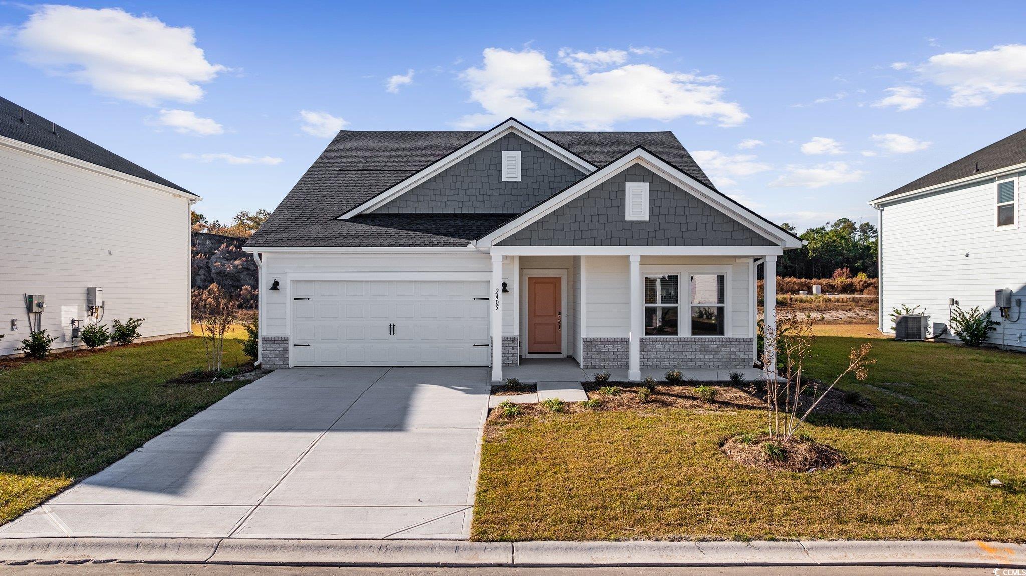 View of front facade with a front yard, a porch, a