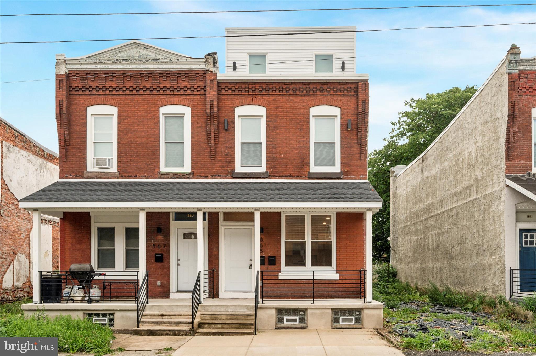 a front view of a house with a porch