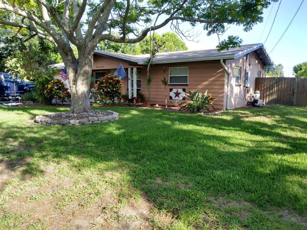 a front view of house with yard having outdoor seating