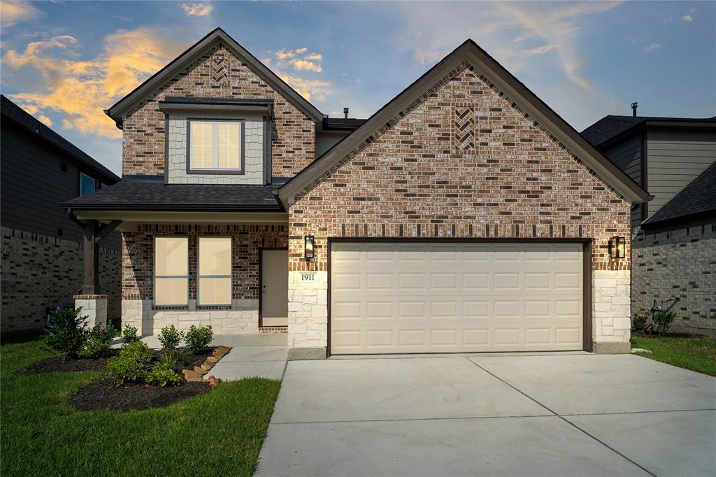 Welcome home to 1911 Scarlet Yaupon Way located in Barton Creek Ranch and zoned to Conroe ISD.