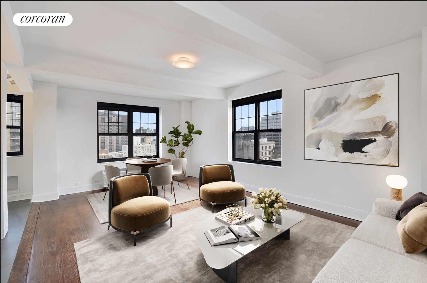 a living room with furniture and hard wood flooring