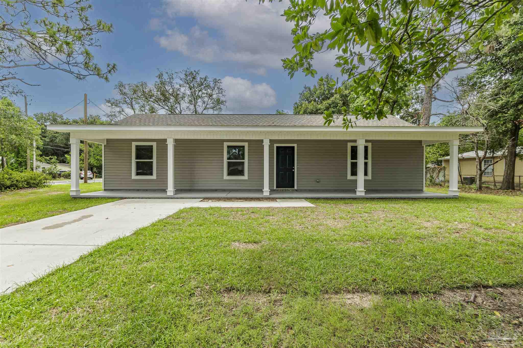 front view of a house with a yard