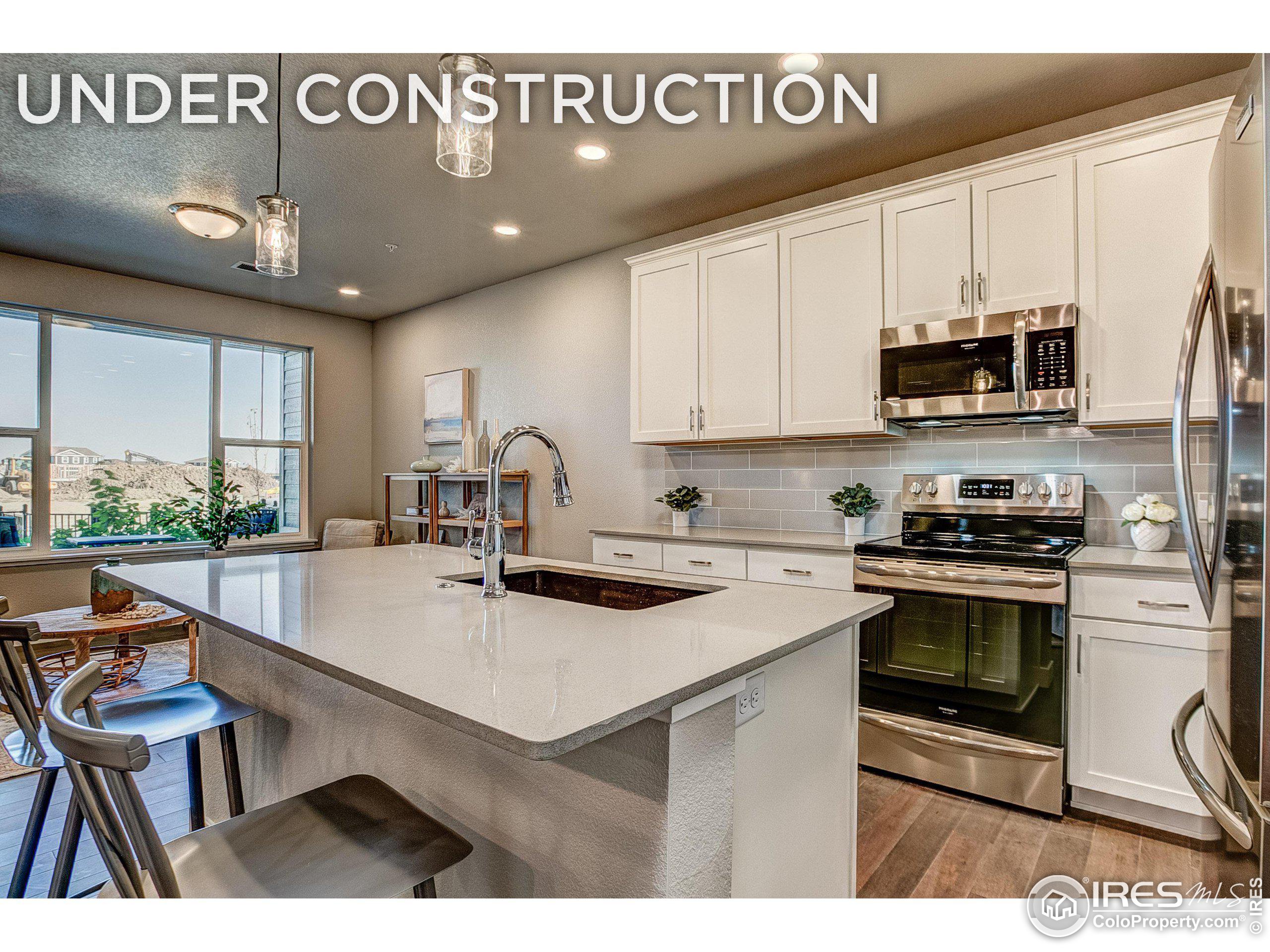 a kitchen with a sink cabinets and window