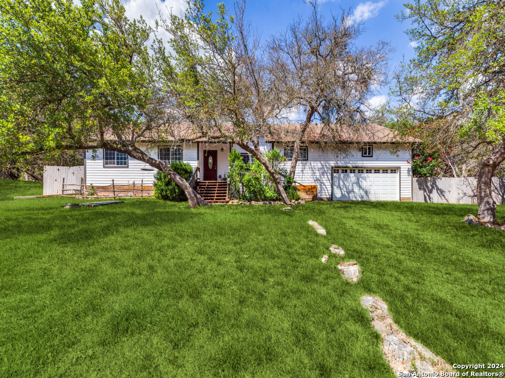 a view of a house with a yard porch and sitting area