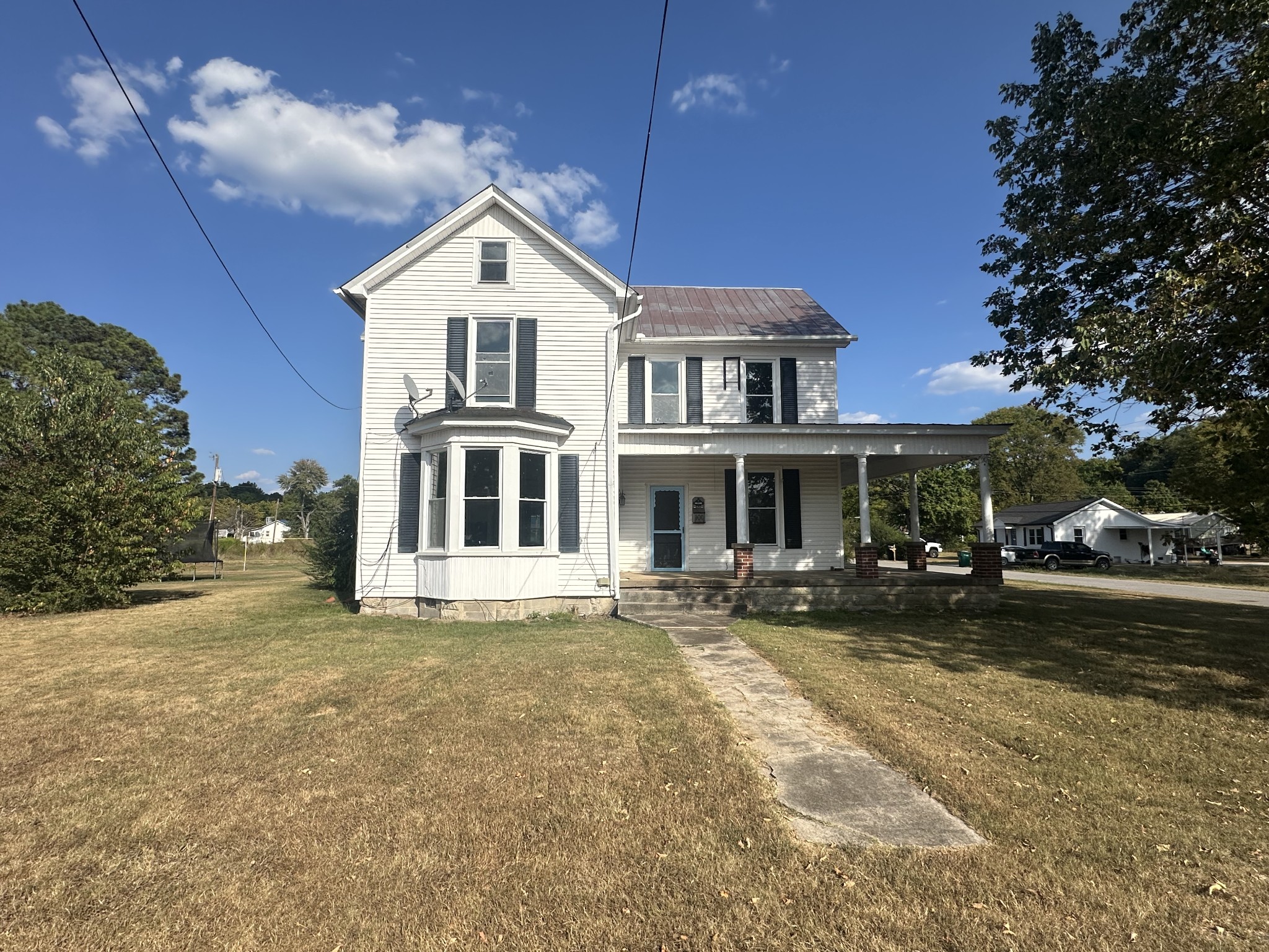 a front view of a house with a yard