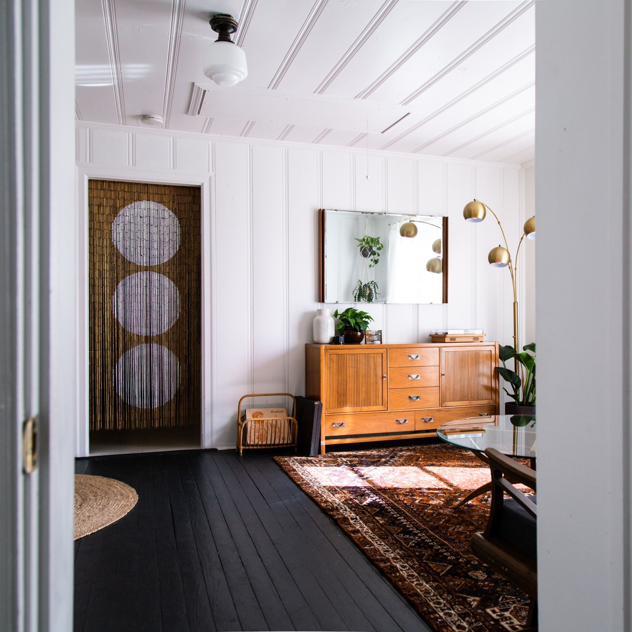 a room with furniture and a potted plant