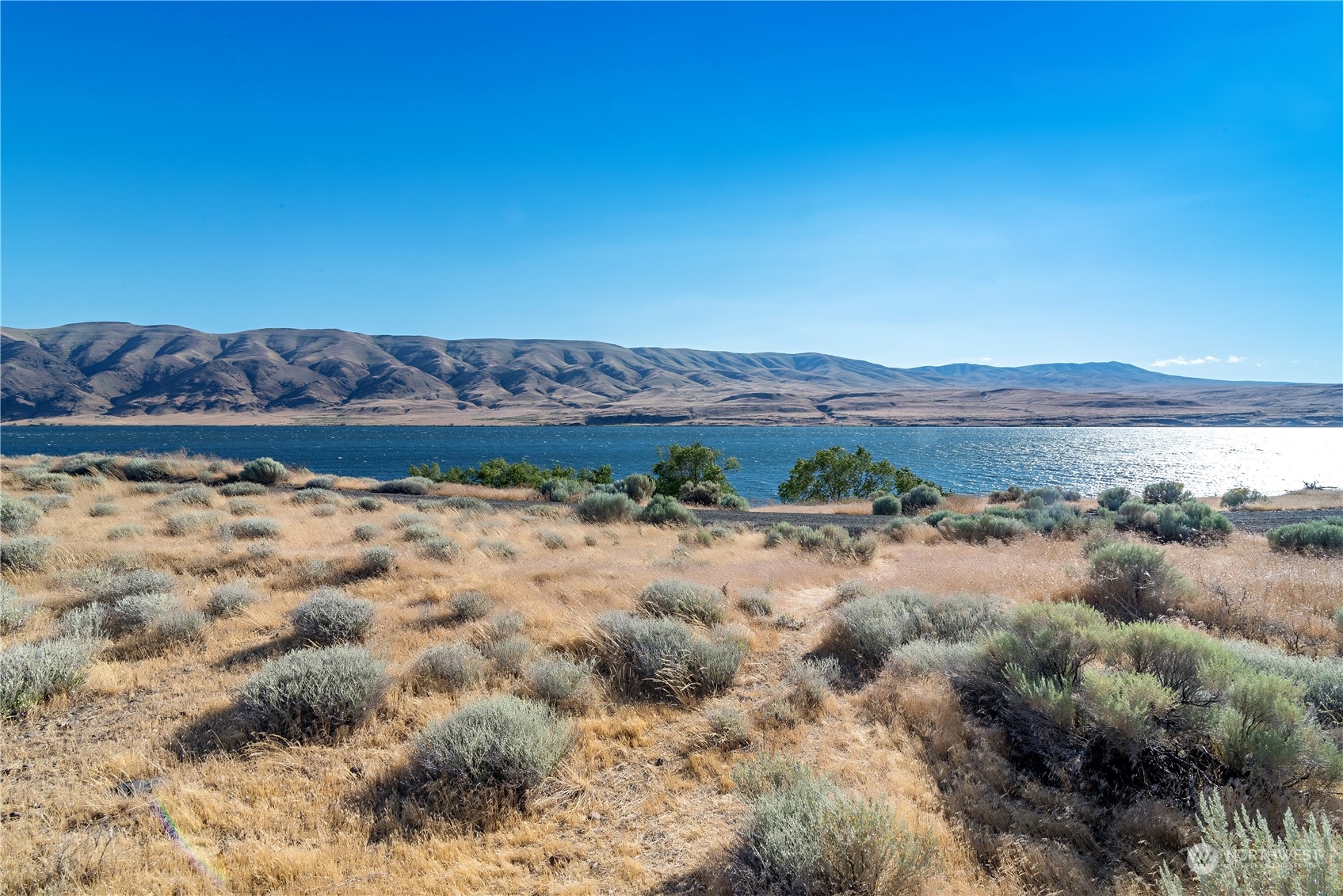 a view of a lake with mountains in the background