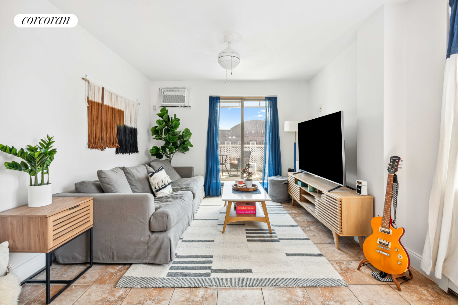 a living room with furniture and a flat screen tv