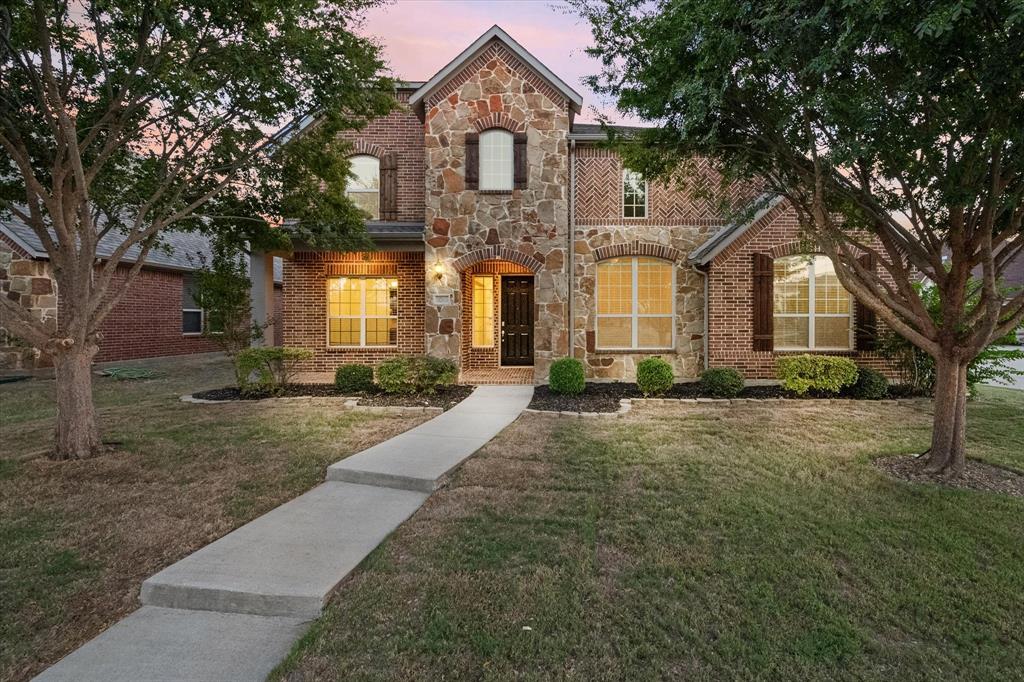 front view of a house with a yard