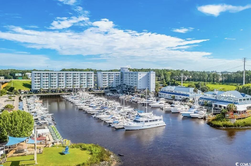 Birds eye view of property featuring a water view