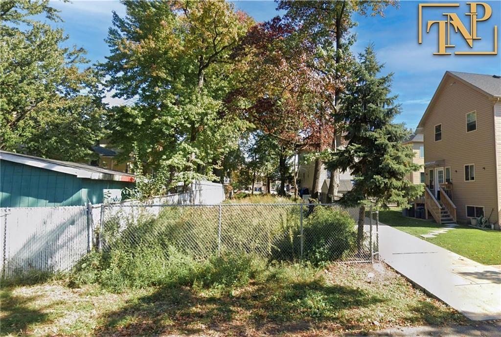 a view of backyard with green space