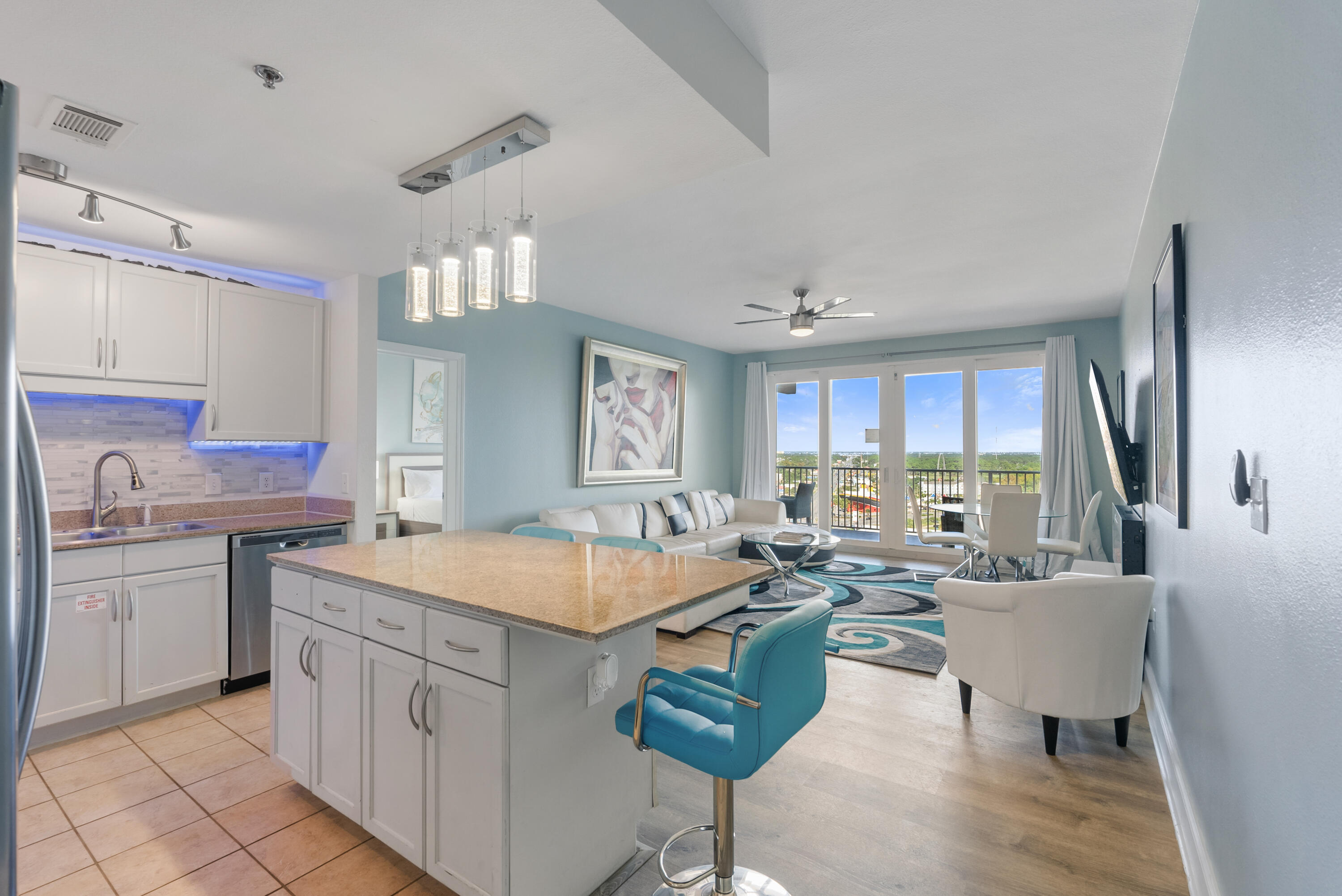 a open kitchen with stainless steel appliances granite countertop a sink stove and refrigerator