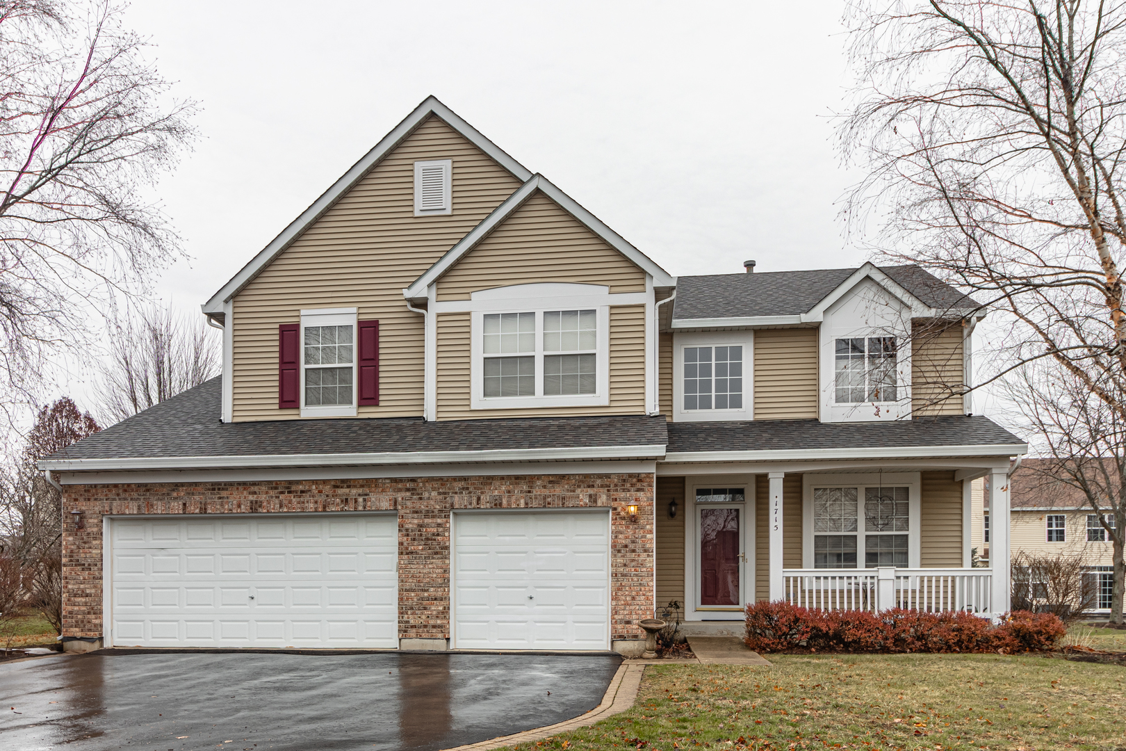 a front view of a house with garage