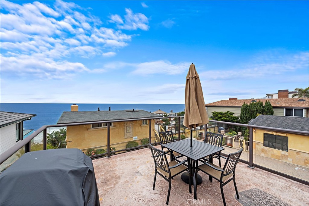 a view of a patio with a table and chairs