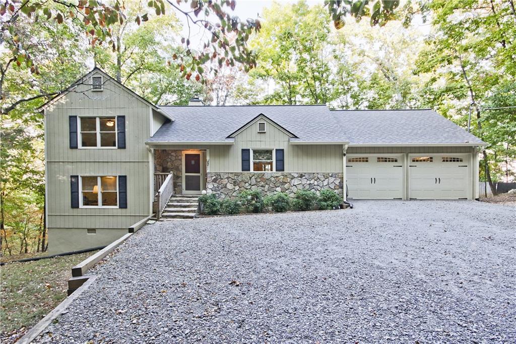 a house that has a tree in front of it