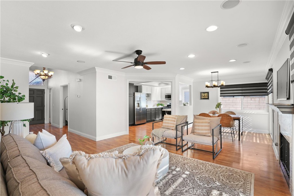 a living room with furniture and kitchen view