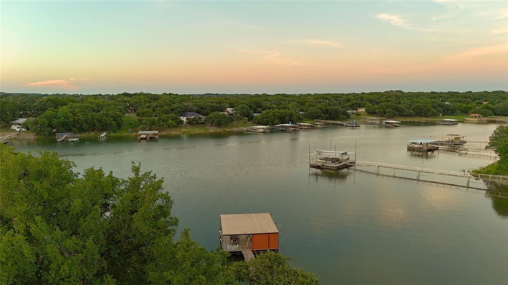 a view of a lake with houses in back