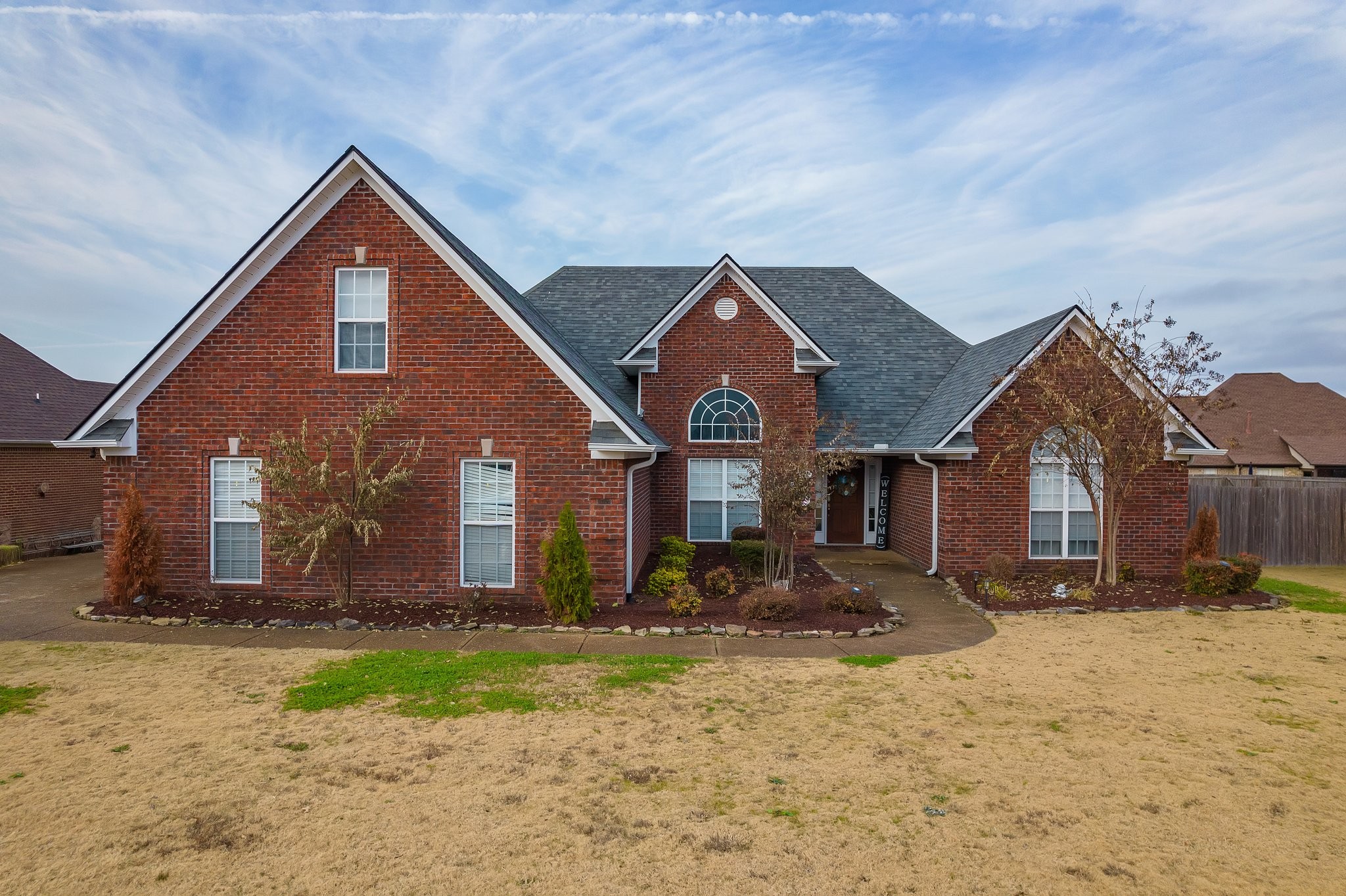 a front view of a house with a yard