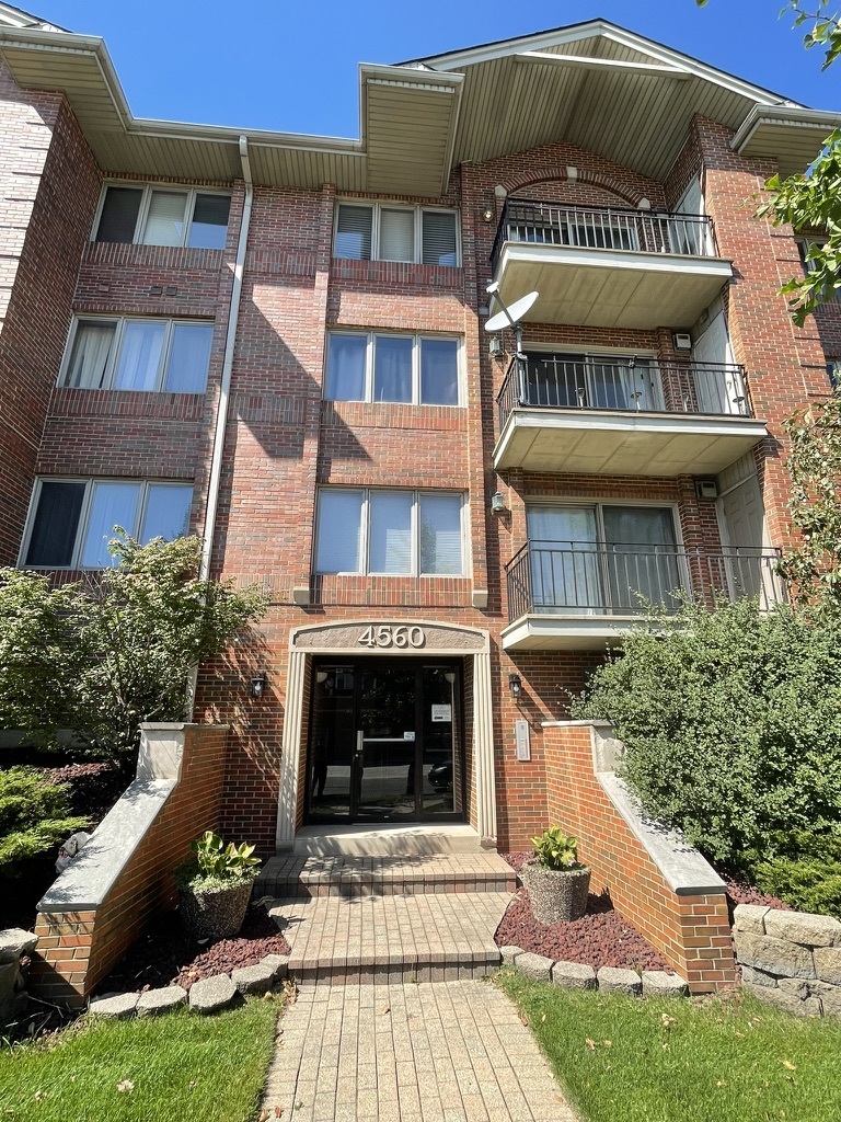 a front view of a multi story residential apartment building