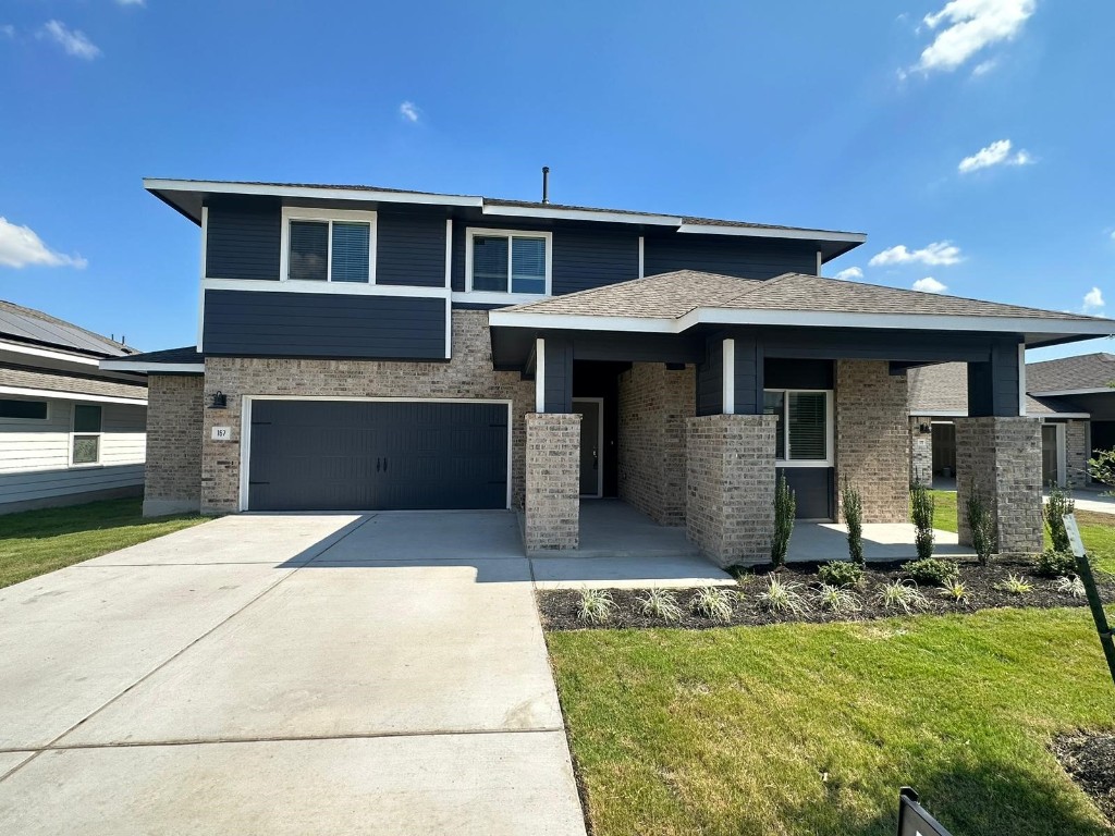 a front view of a house with yard