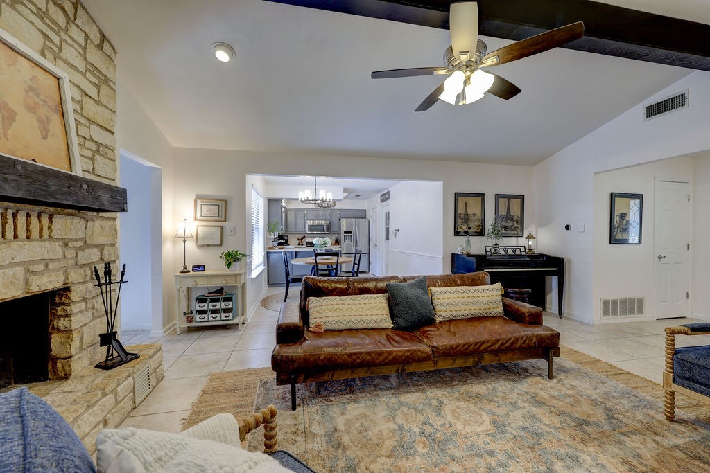 a living room with furniture and a fireplace