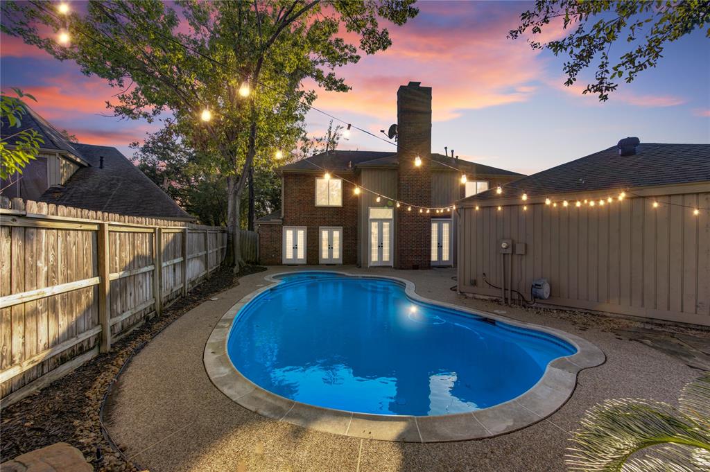 a view of a swimming pool with a patio