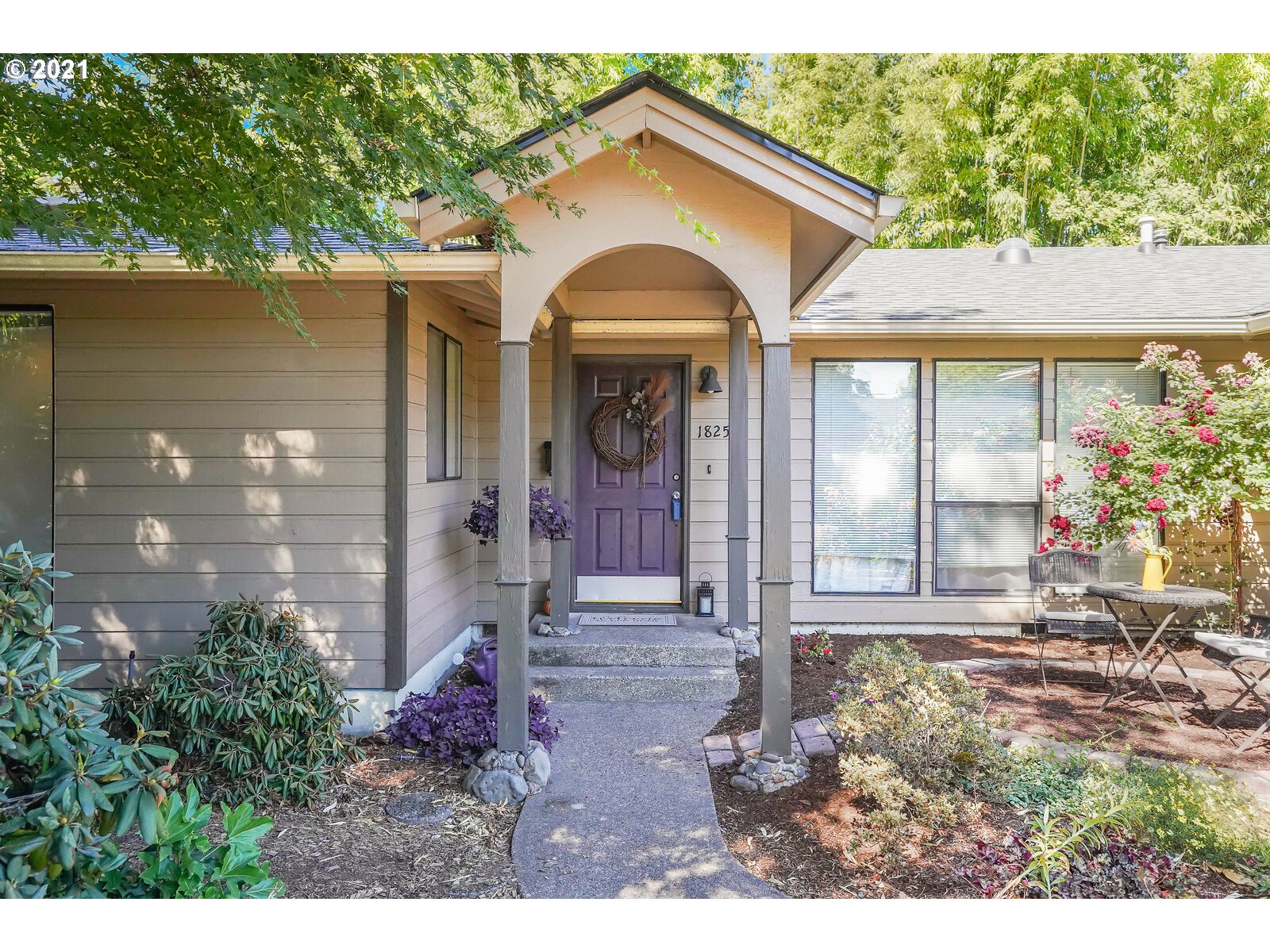 a front view of a house with garden