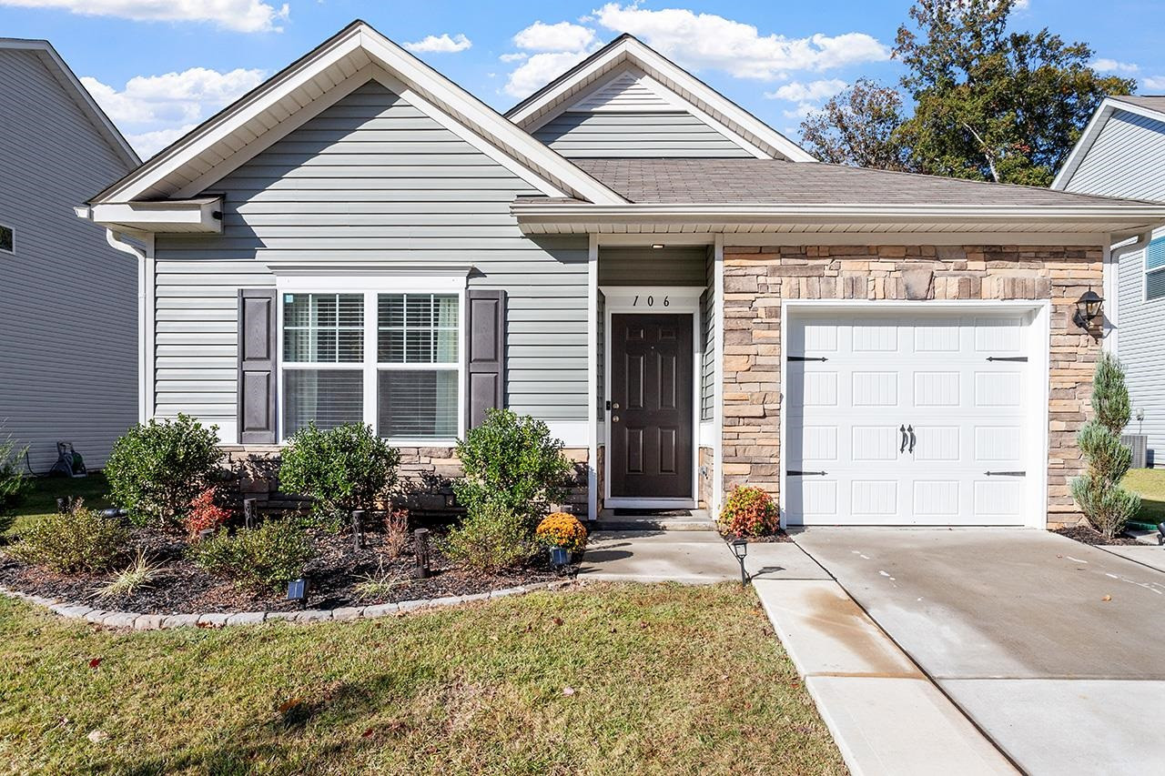 a front view of a house with a yard