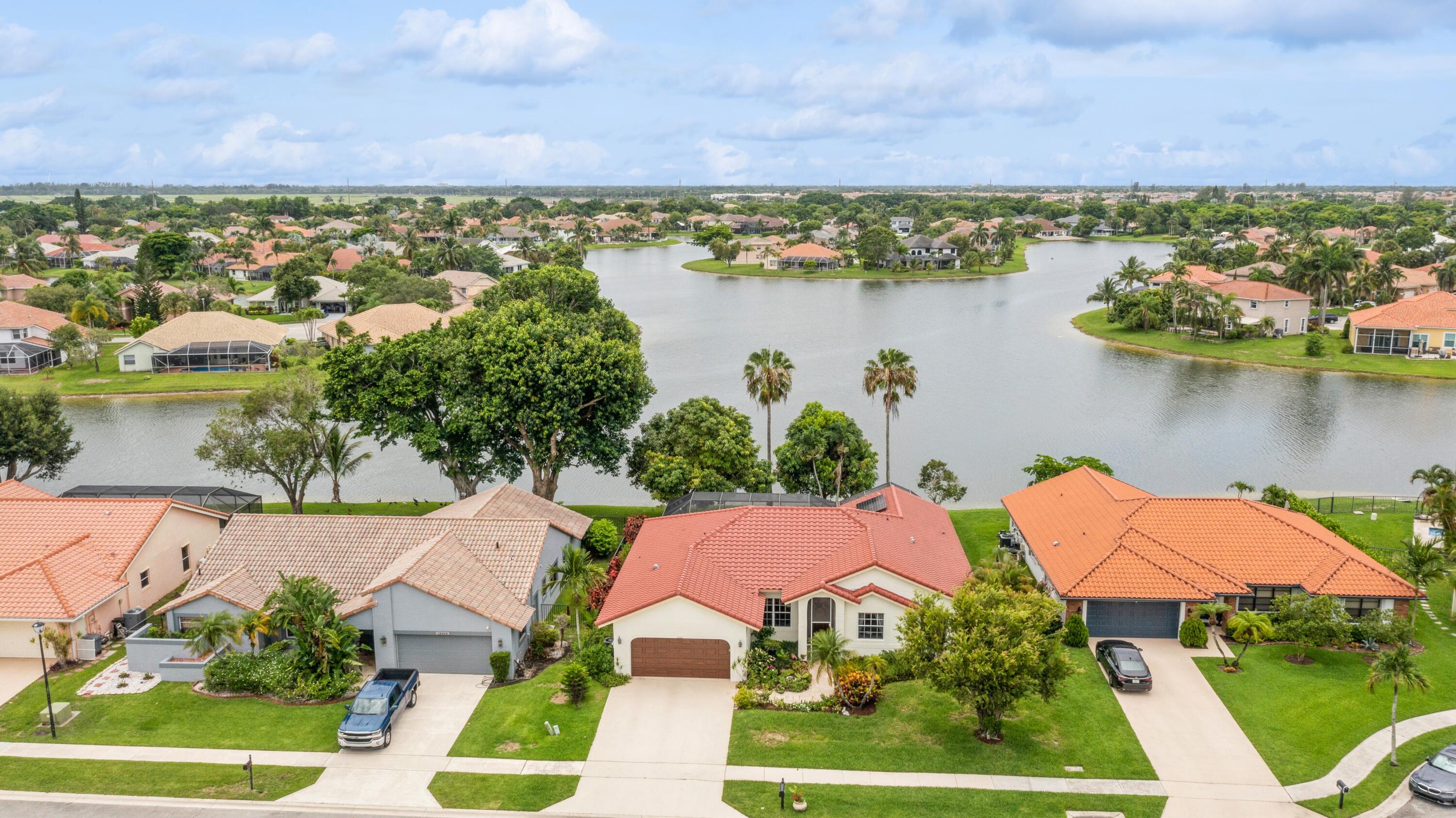 an aerial view of a house with a lake view