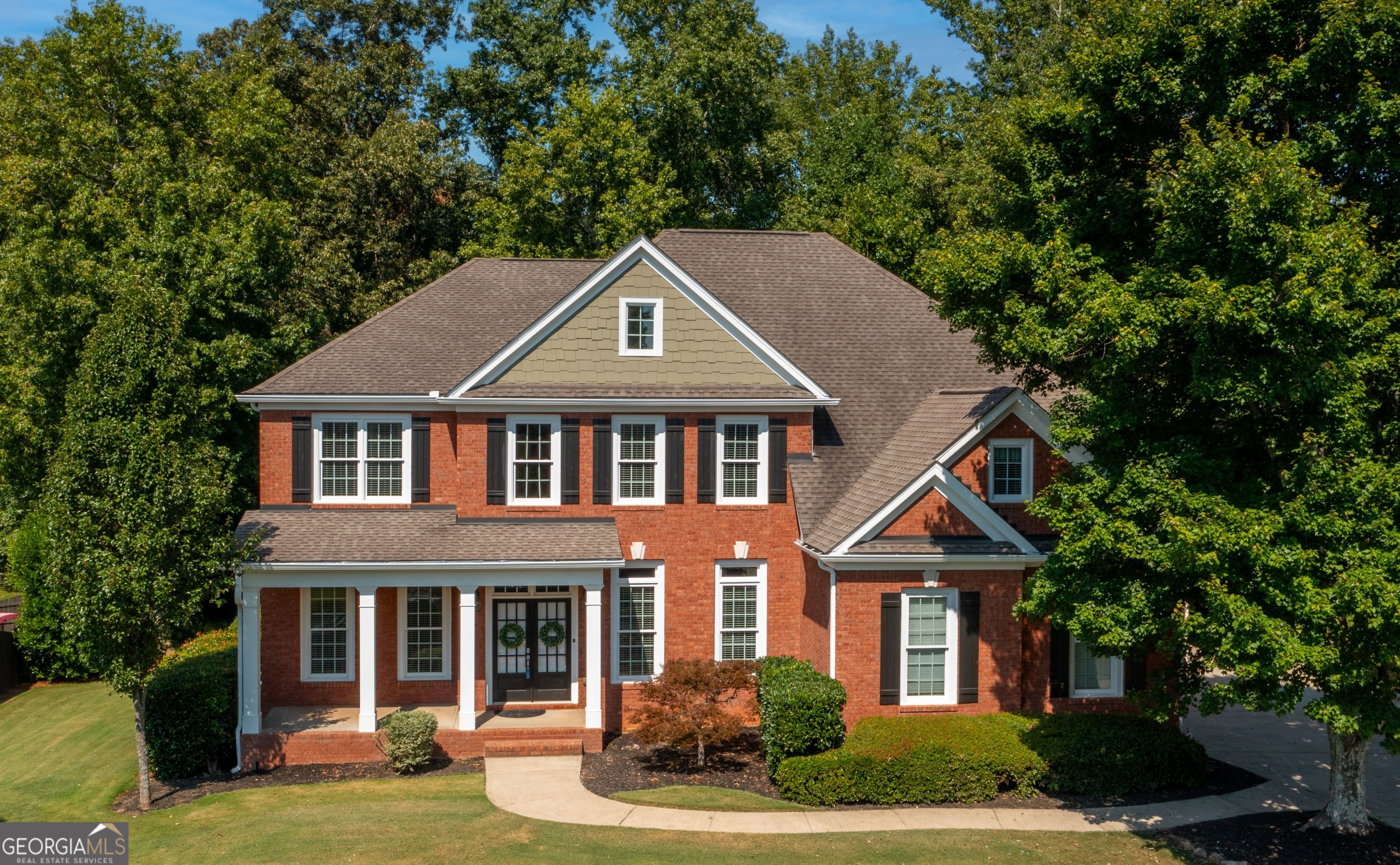 front view of a house with a yard