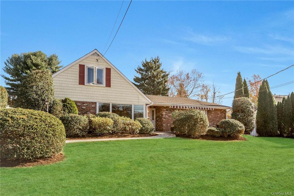 View of front of home featuring a front lawn