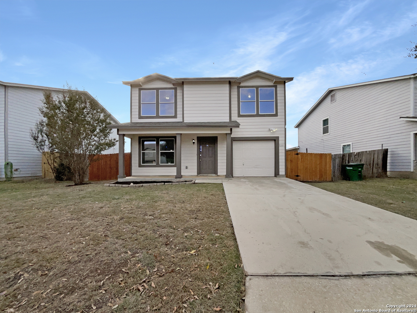 a front view of a house with a garage