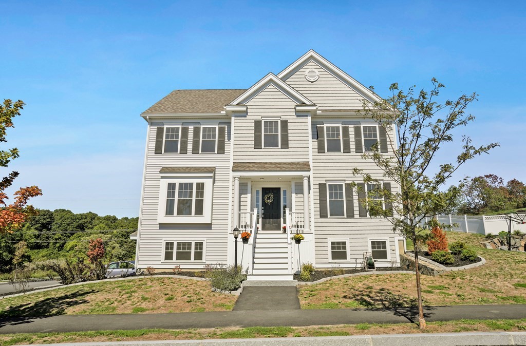 front view of a house with a yard