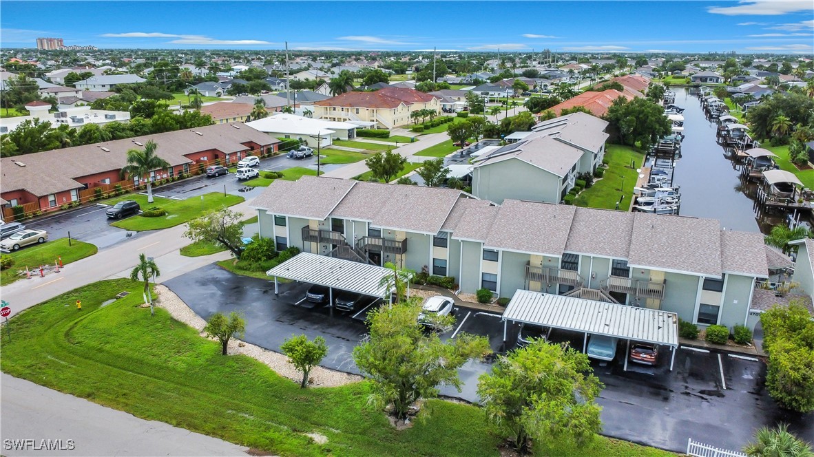 an aerial view of a houses with a yard