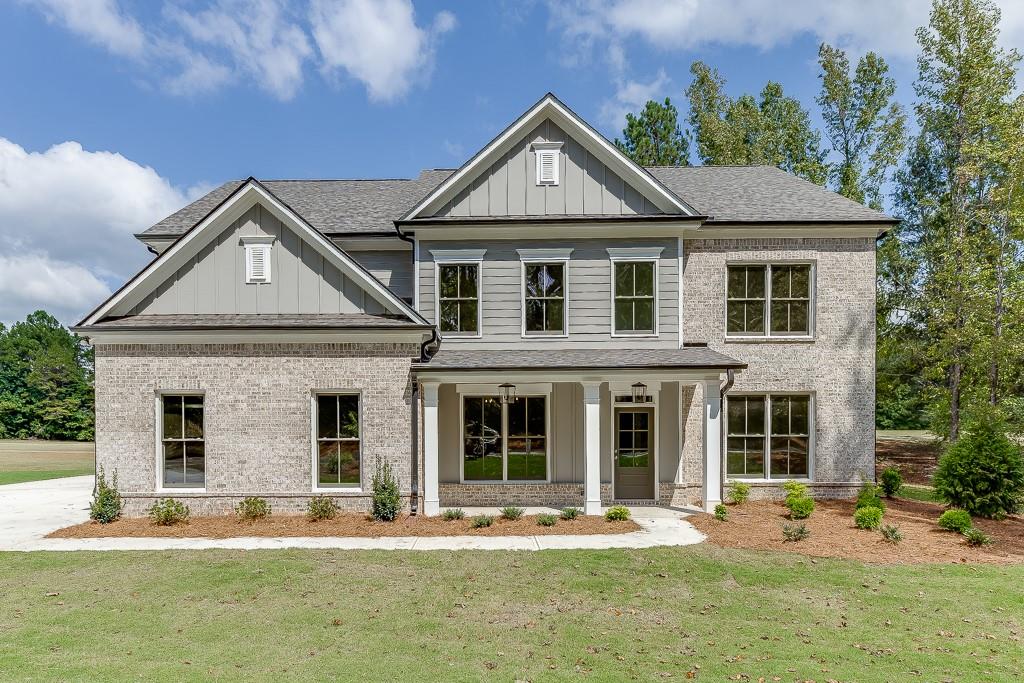 a front view of a house with a yard