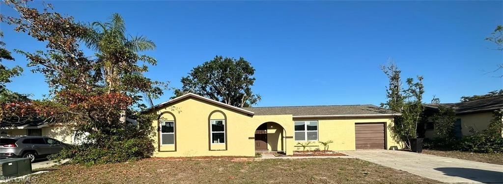 View of front of property featuring a garage