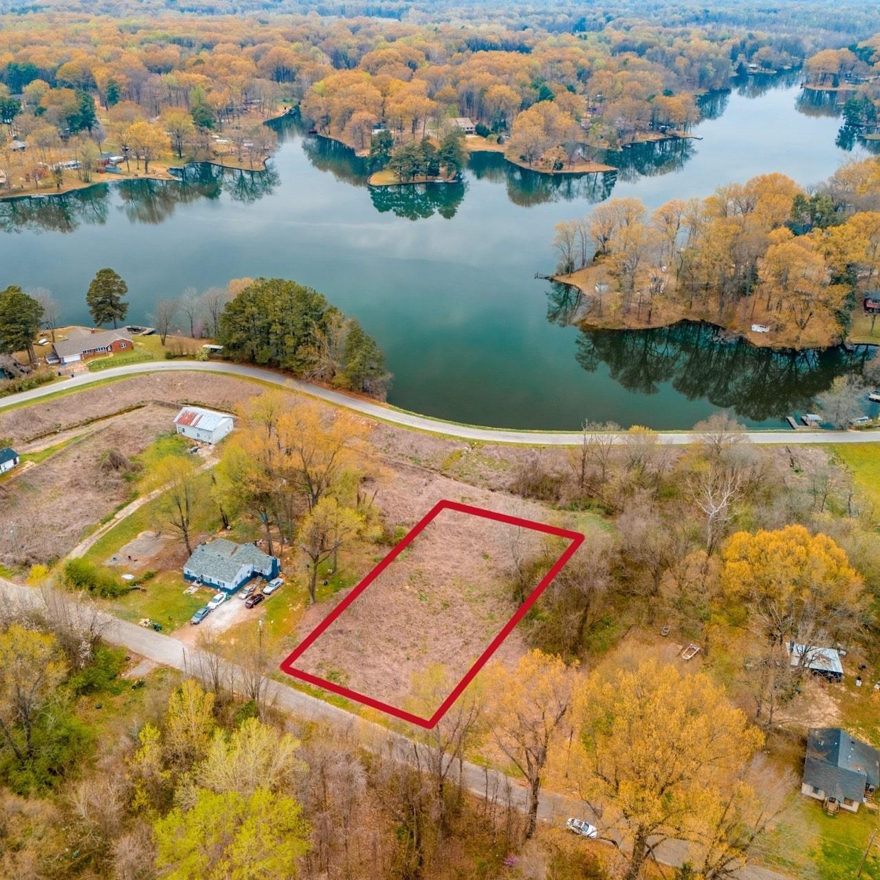 an aerial view of a house with yard