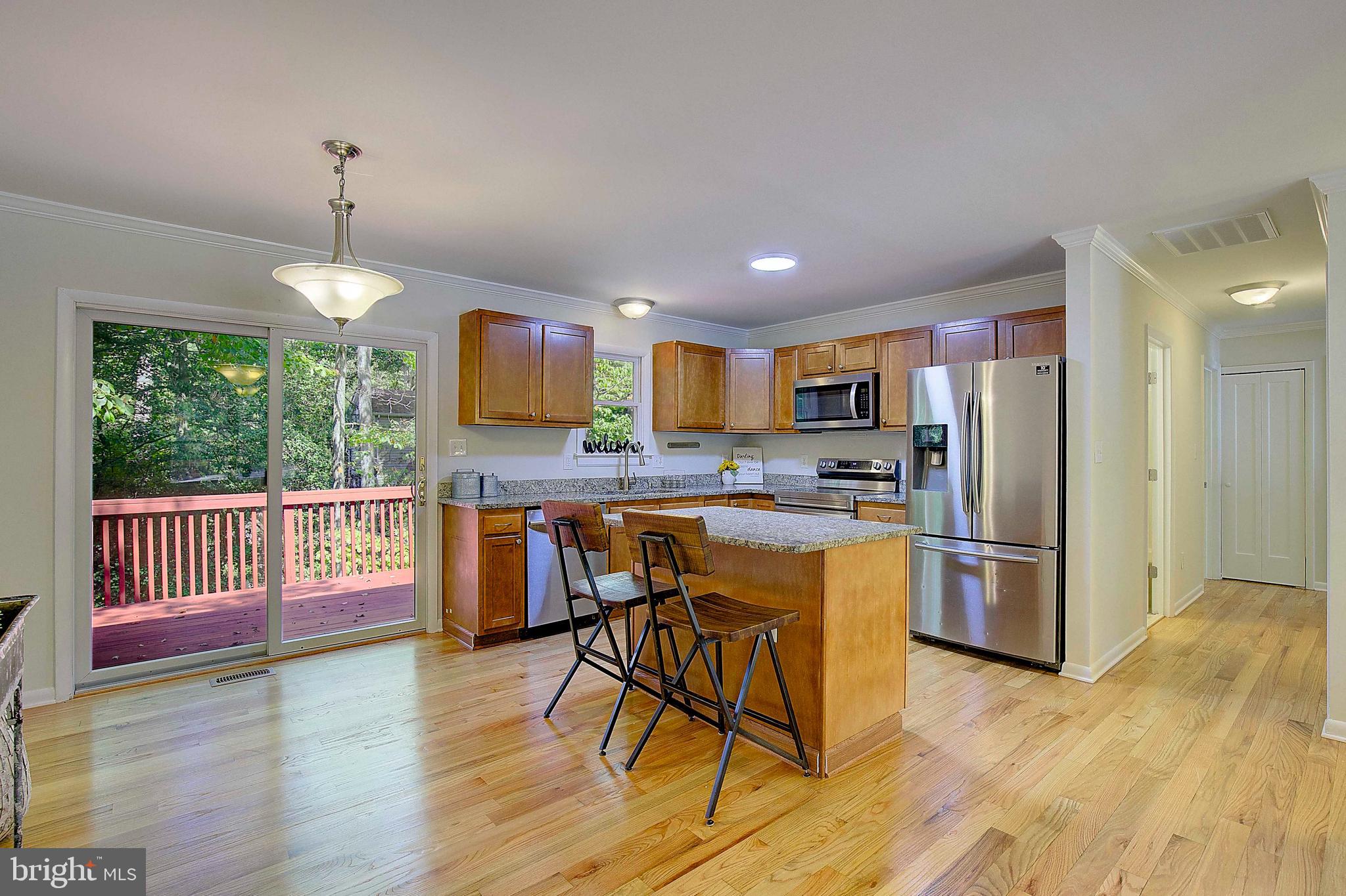 a kitchen with refrigerator and window