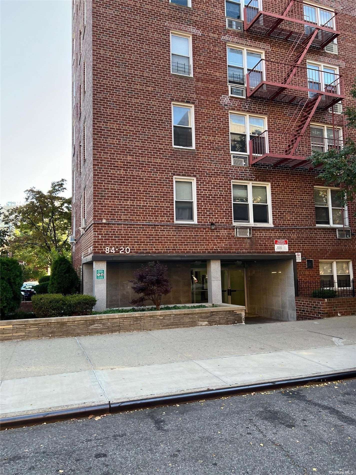 a view of a building with a street