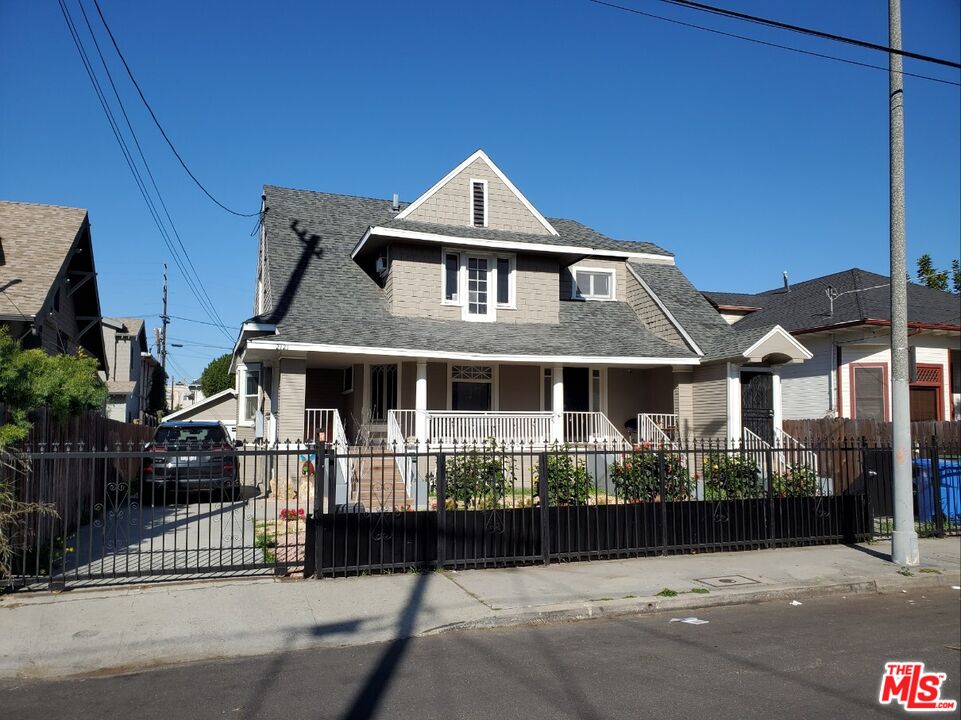 a front view of a house with a fence