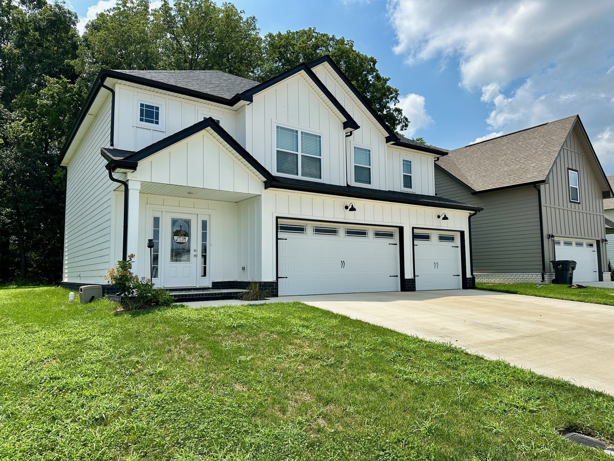 a front view of a house with a yard