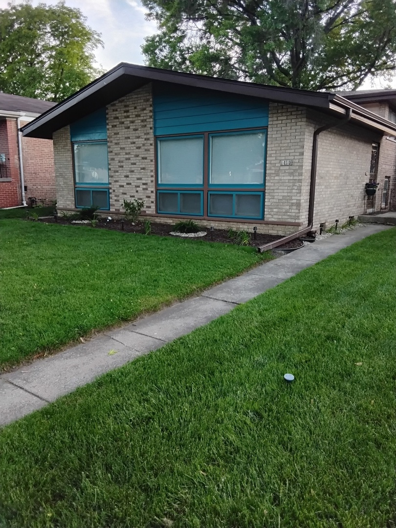 a small barn with a small yard