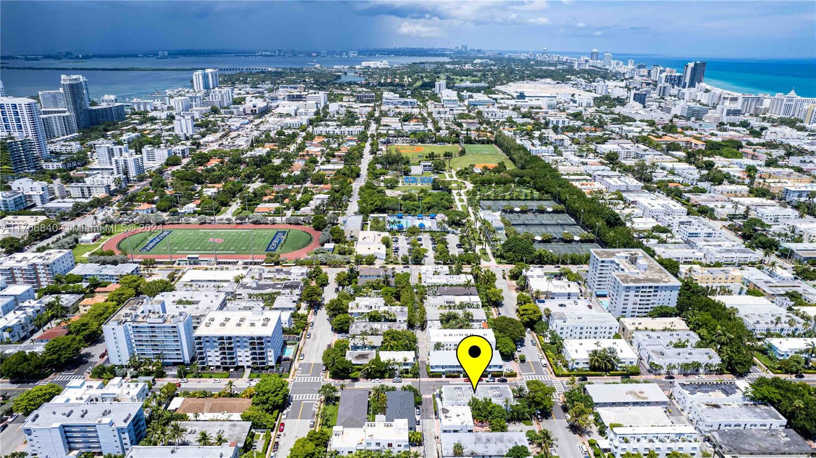 an aerial view of residential houses with city view